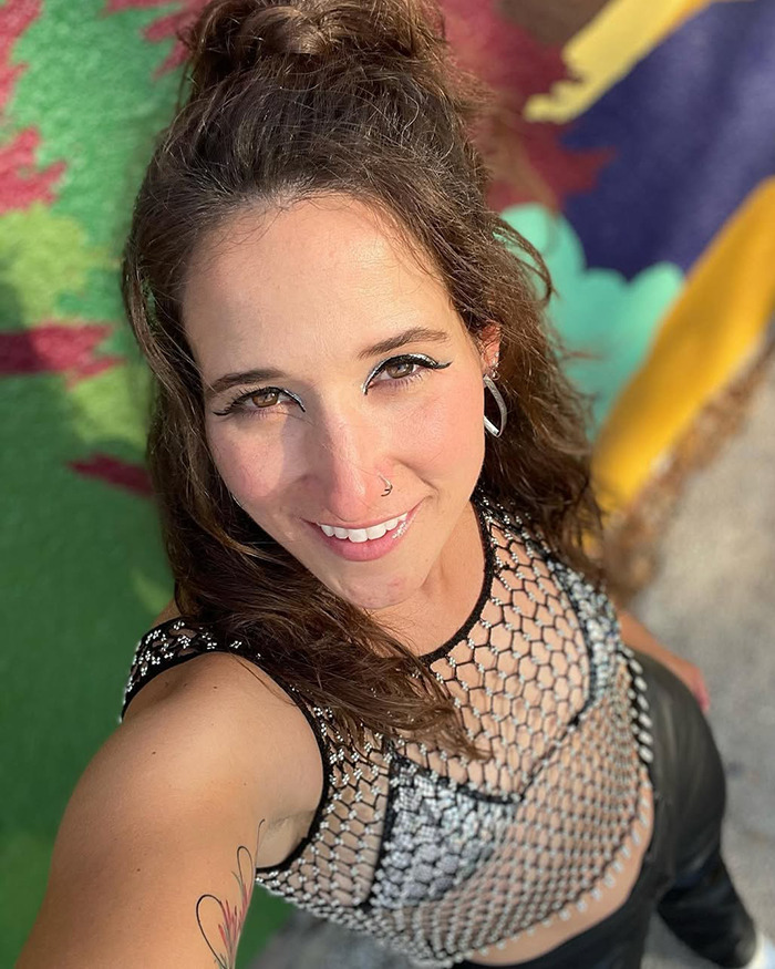 Wyoming resident Britt Boril smiling outdoors wearing a netted top. Wyoming resident Britt Boril smiling outdoors wearing a netted top.
