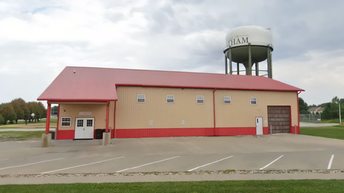 After-school camp building in Illinois near water tower, site related to four young victims vehicle crash incident.