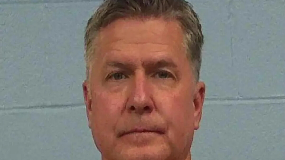 Mugshot of a middle-aged man accused as a divorce lawyer in a clientu2019s cold-case m****r investigation by police.