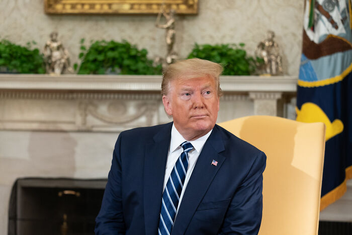 Donald Trump seated in the Oval Office during a discussion about Congress greenlighting his big, beautiful bill.
