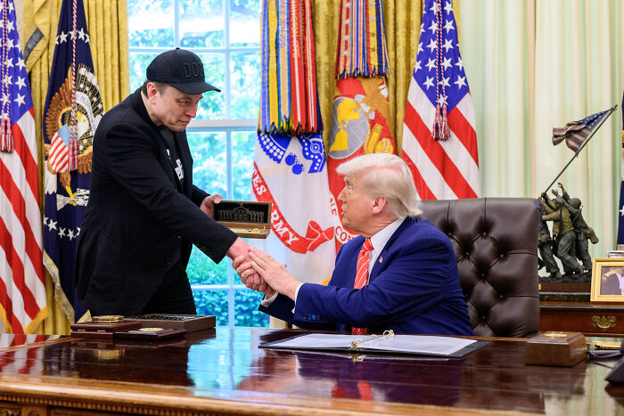 Elon Musk shaking hands with a former president in the Oval Office, hinting at a new political party launch.