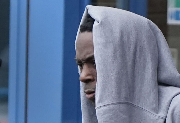 Man wearing a gray hoodie looking serious outdoors related to Aristocrat Constance Marten and partner case