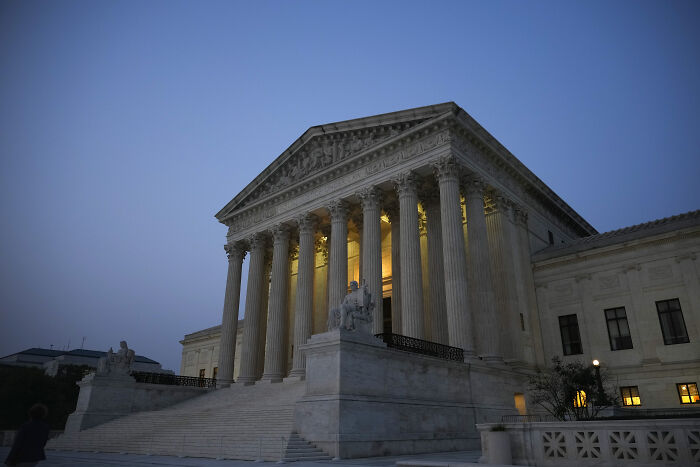 U.S. Supreme Court building at dusk, symbolizing legal aspects of Barron Trump’s U.S. citizenship debate.
