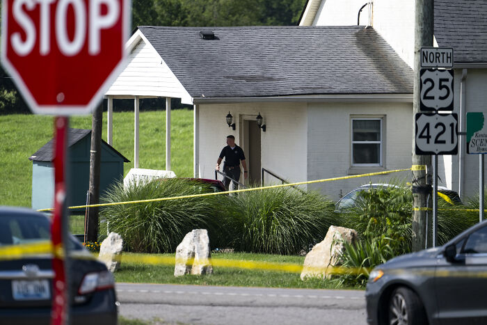 Police investigate crime scene near Kentucky airport and church after shootings with two killed and three injured.