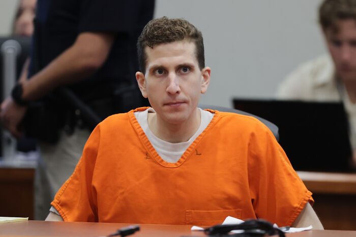 Bryan Kohberger in an orange prison jumpsuit appearing in court as new shocking documents reveal victim details.