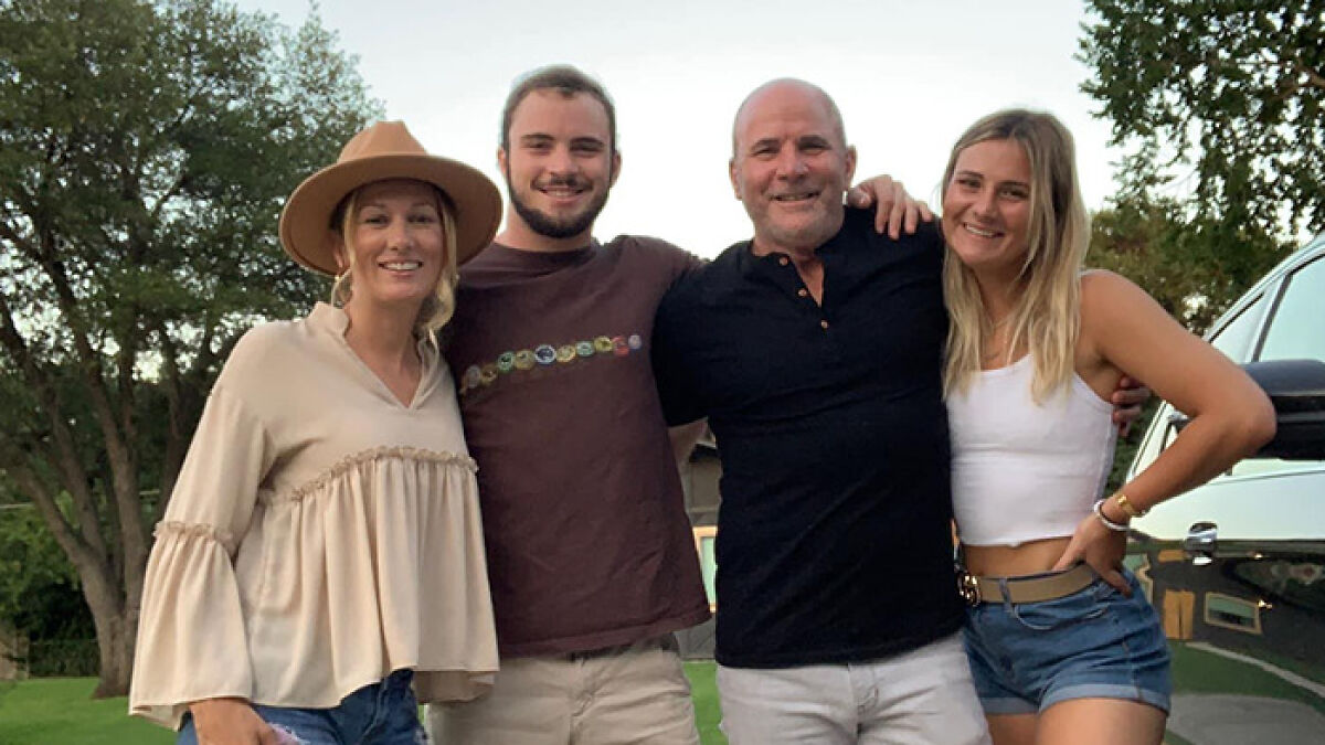Family posing outdoors, remembering dad who left soul-crushing voicemails before Texas floods swept him away