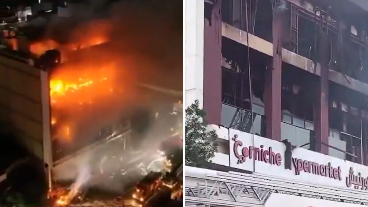 Fire engulfing Iraq shopping center with heavy smoke and visible damage after air conditioner reportedly explodes.