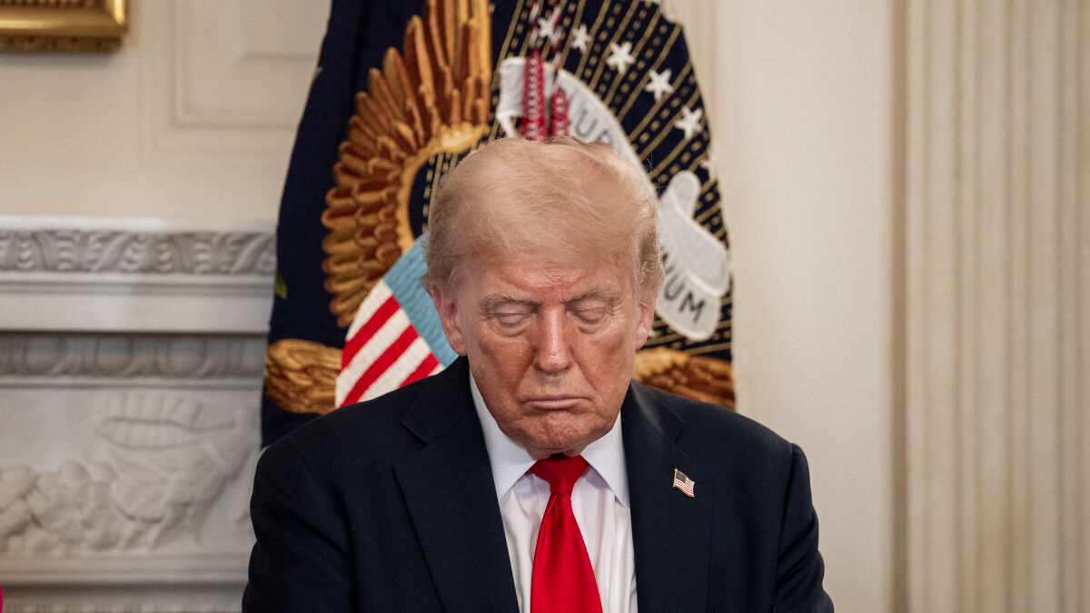 Former president sitting with eyes closed in front of presidential seal, representing 2024 presidential election impact on mental health.