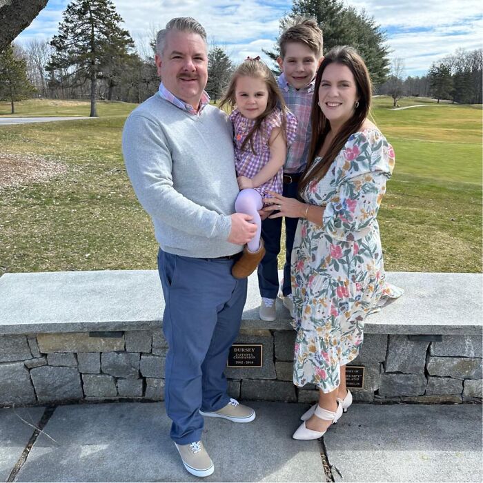 Family portrait of a man, woman, and two children outdoors, related to husband’s brain cancer and TikTok posts.