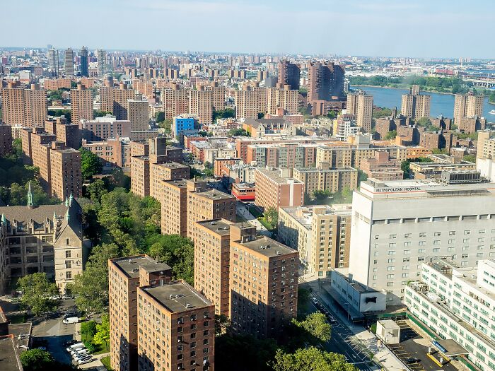 Aerial view of New York City buildings and Metropolitan Hospital amid Legionnaires’ disease outbreak affecting residents.