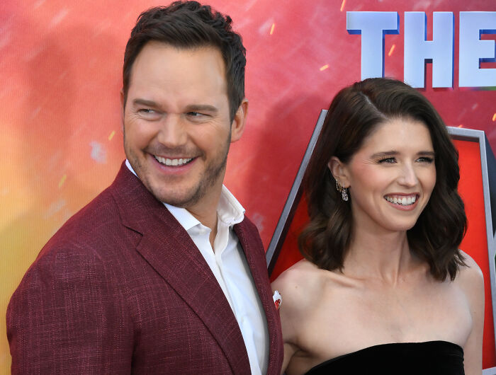 Chris Pratt smiling with his wife at a red carpet event amid RFK Jr. and MAHA uproar.