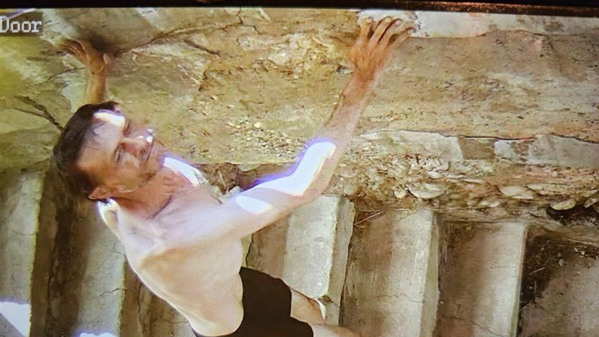 Manhunt for Montana bar shooting suspect showing a shirtless man climbing stone stairs, authorities warn suspect could return.