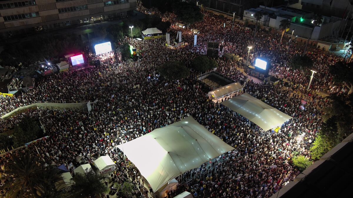 Thousands of Israelis gathered at night demanding an end to war in Gaza after Hamas hostage footage revealed starving victims.