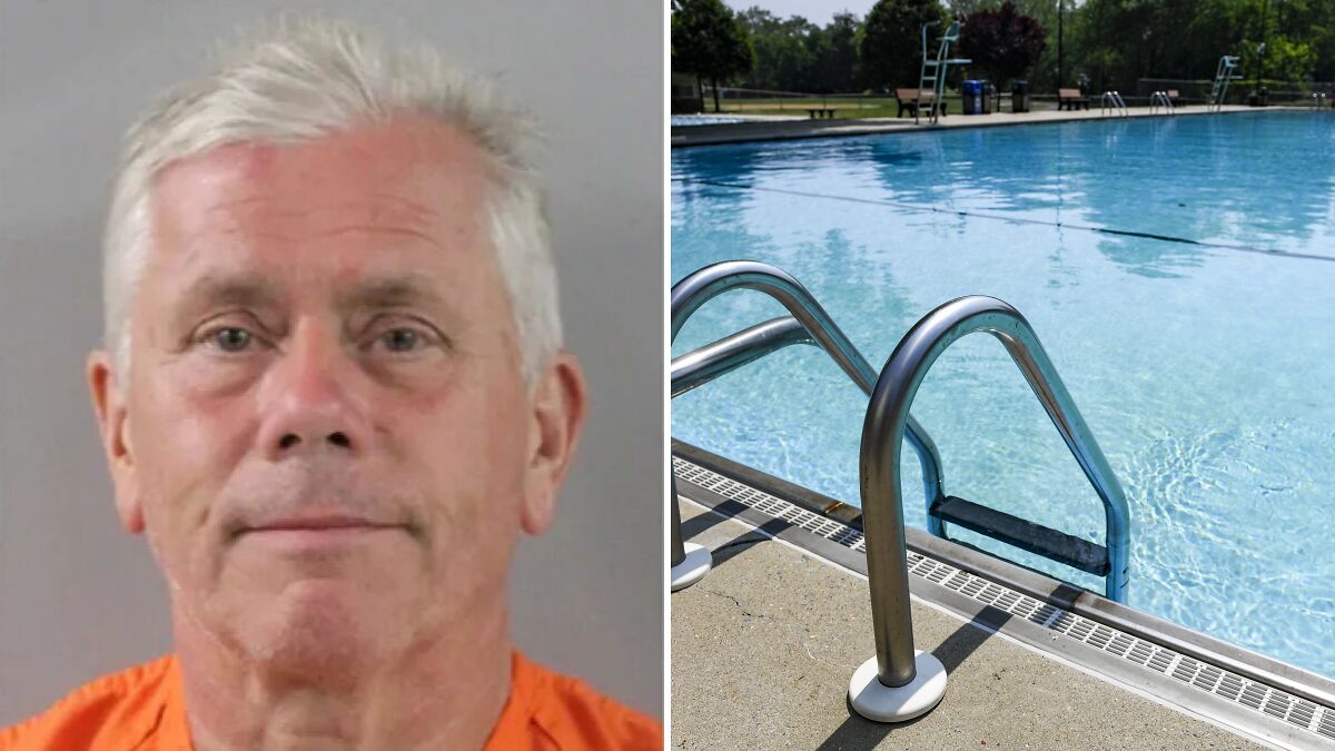 Older man in orange shirt next to an empty outdoor swimming pool with metal railings and clear water