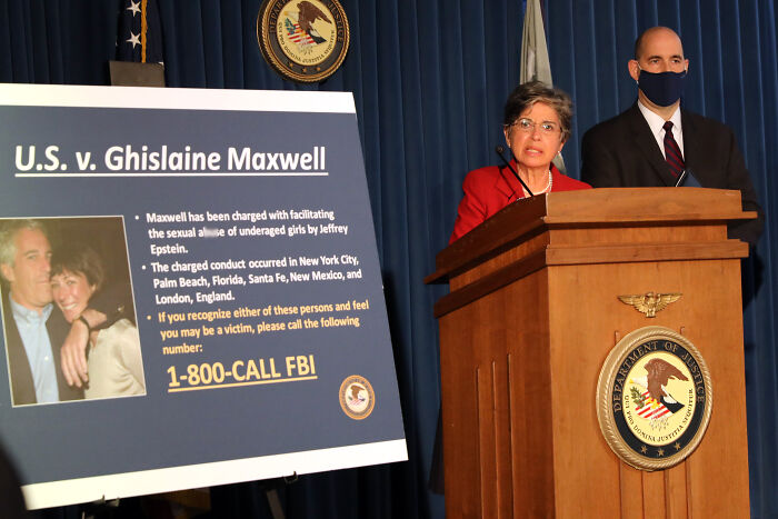 DOJ staffer speaking at podium with Epstein files sign, discussing Republican names and legal case details.