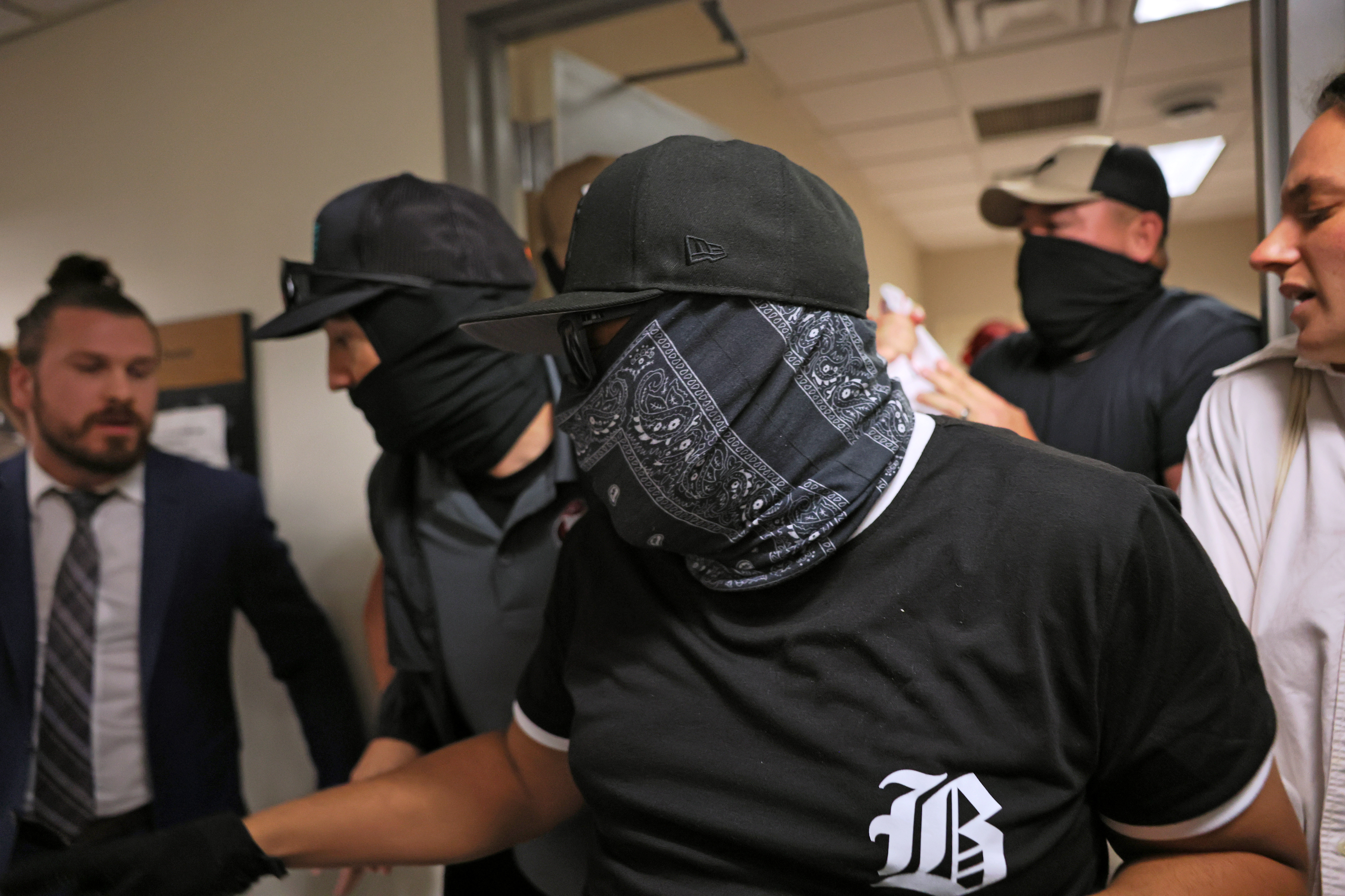 Inside The Secret Digital Network Outing ICE Agents One Mask At A Time