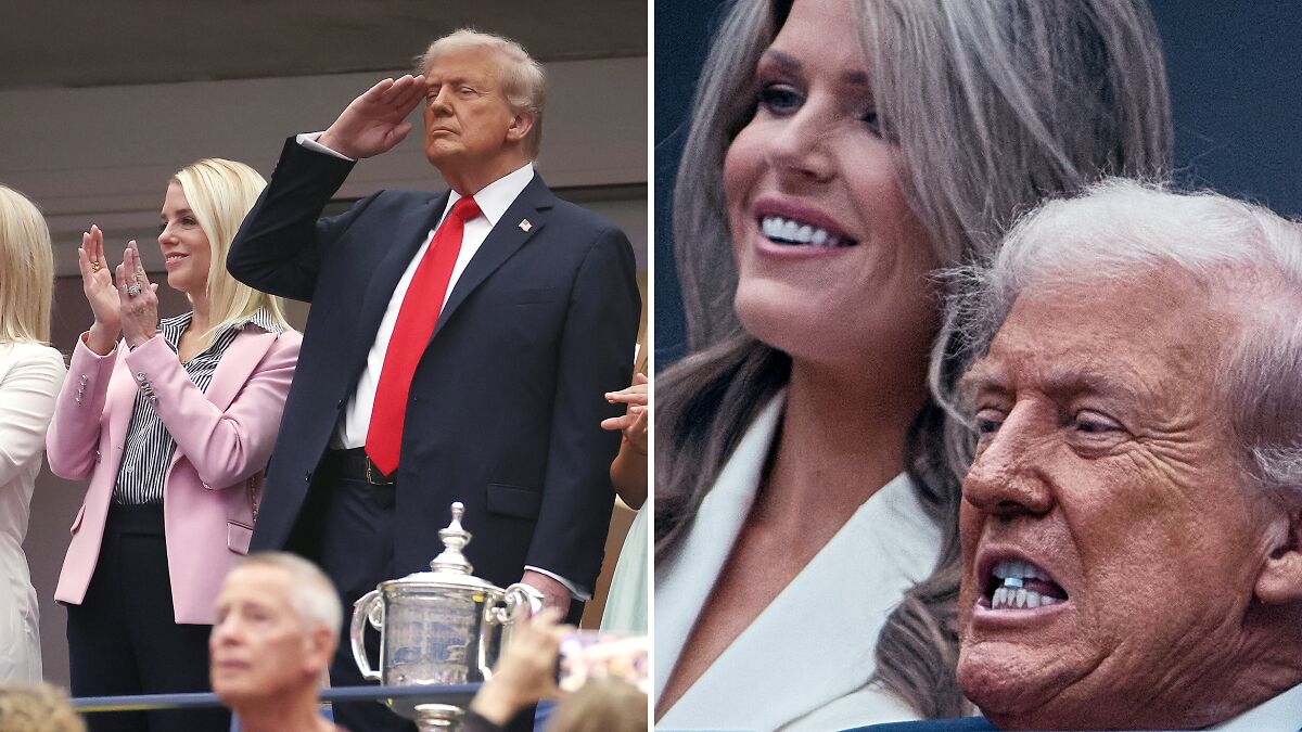 Donald Trump, 79, chomping on a mysterious blue object with a woman smiling beside him at a public event.