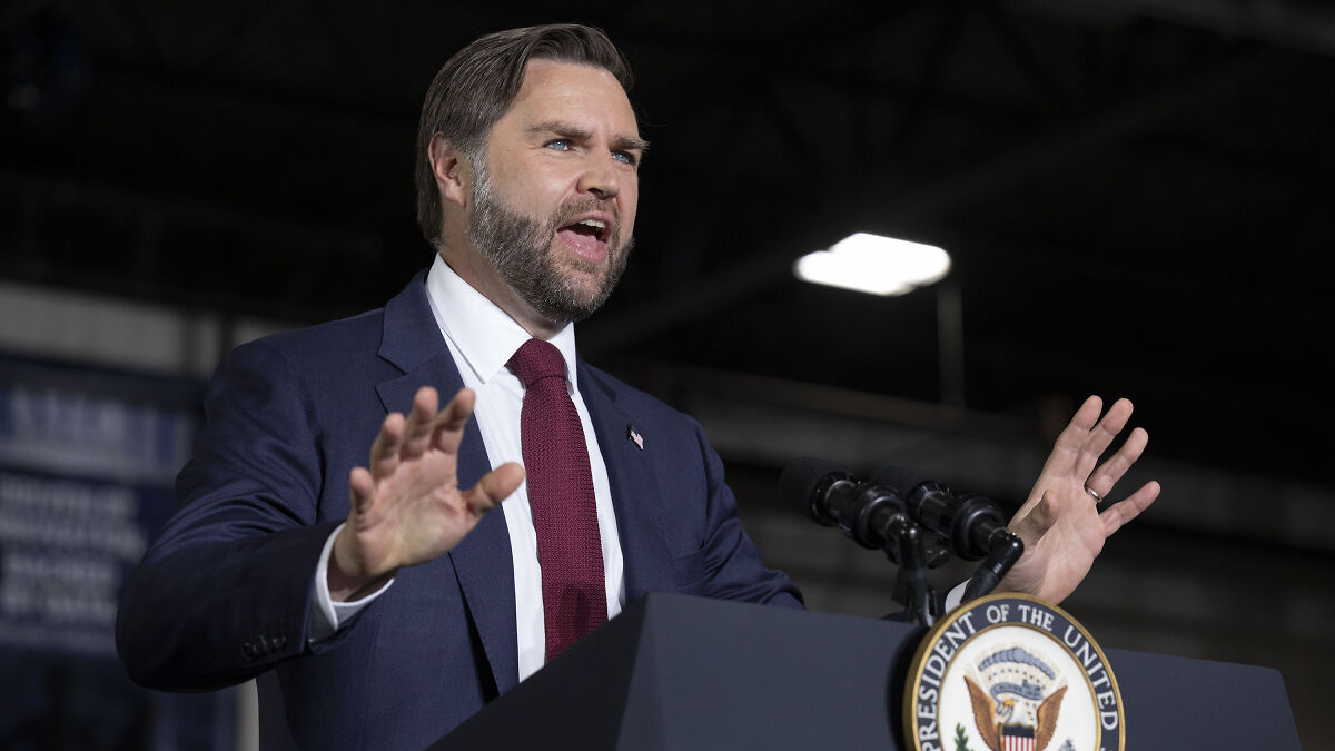 JD Vance speaking at a presidential podium, gesturing with hands during a political event on Venezuelan boat strikes.
