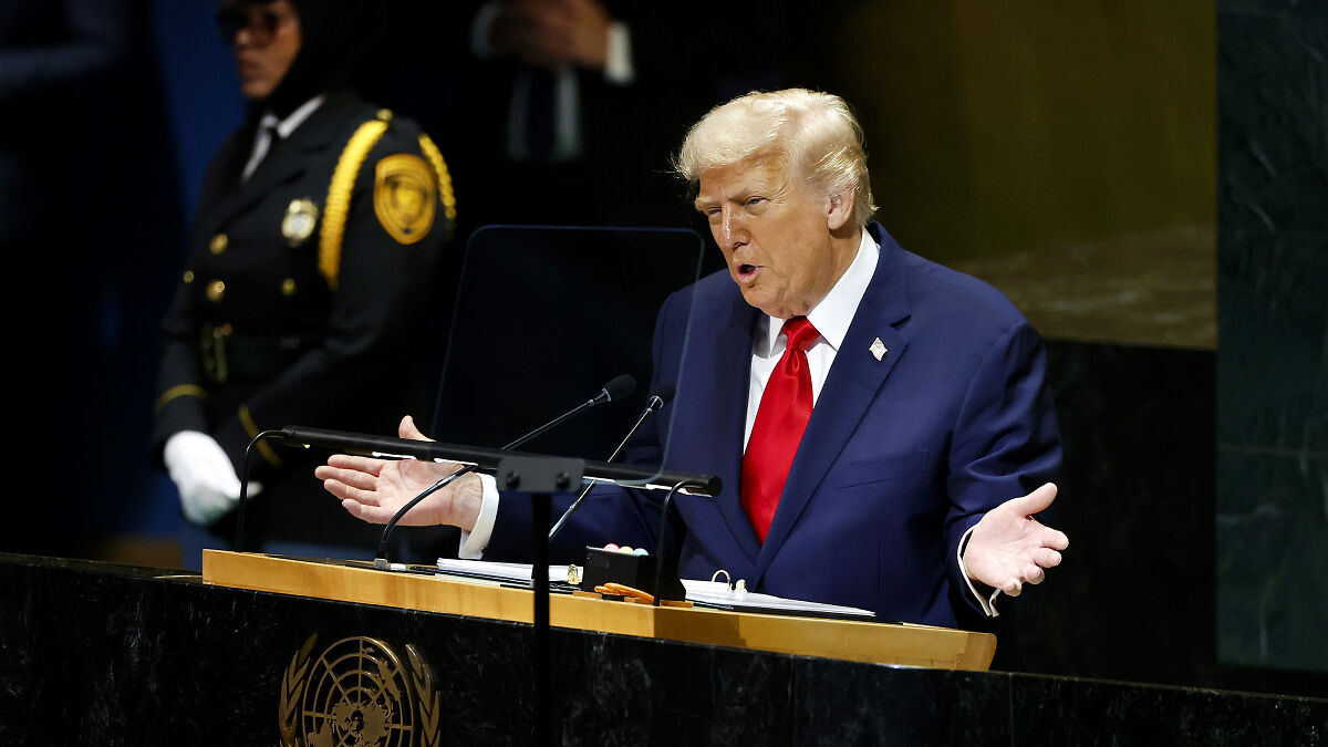 Donald Trump speaking at UN General Assembly focusing on immigration and Europe during a formal session.
