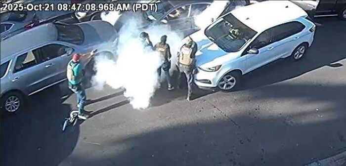 LA TikToker filming ICE raids shot and arrested during immigration operation with officers near white vehicles in daylight.