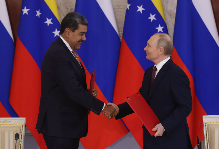 Venezuelan leader Maduro shaking hands with Russian president amid rising U.S. Venezuela tensions and war concerns Venezuelan leader Maduro shaking hands with Russian president amid rising U.S. Venezuela tensions and war concerns