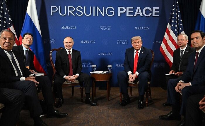 Donald Trump and Vladimir Putin seated during Alaska 2025 peace talks, amidst rising tensions and nuclear displays. Donald Trump and Vladimir Putin seated during Alaska 2025 peace talks, amidst rising tensions and nuclear displays.