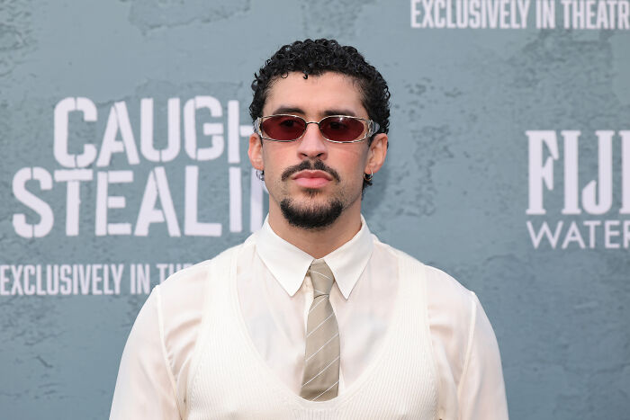 Man with sunglasses and goatee at event, related to Mike Johnson’s role model choice replacing Bad Bunny at Super Bowl.
