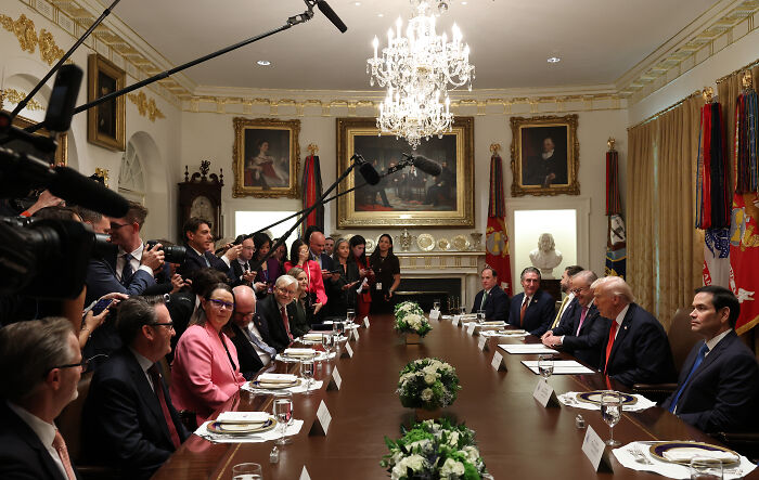 Donald Trump at a White House meeting with officials and media presence after learning visitor called him nuts