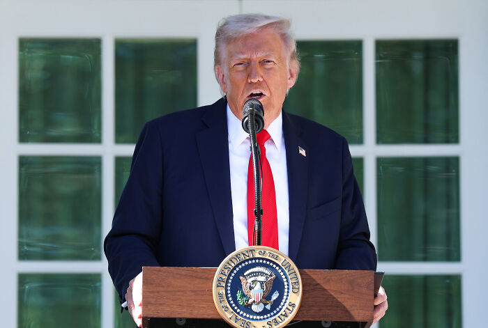 Former President Trump speaking at a podium during an announcement about nuclear weapons testing orders from the Pentagon. Former President Trump speaking at a podium during an announcement about nuclear weapons testing orders from the Pentagon.