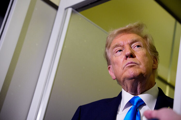 Donald Trump looking upward with serious expression, relating to magnets and steam aboard aircraft carrier discussion. Donald Trump looking upward with serious expression, relating to magnets and steam aboard aircraft carrier discussion.