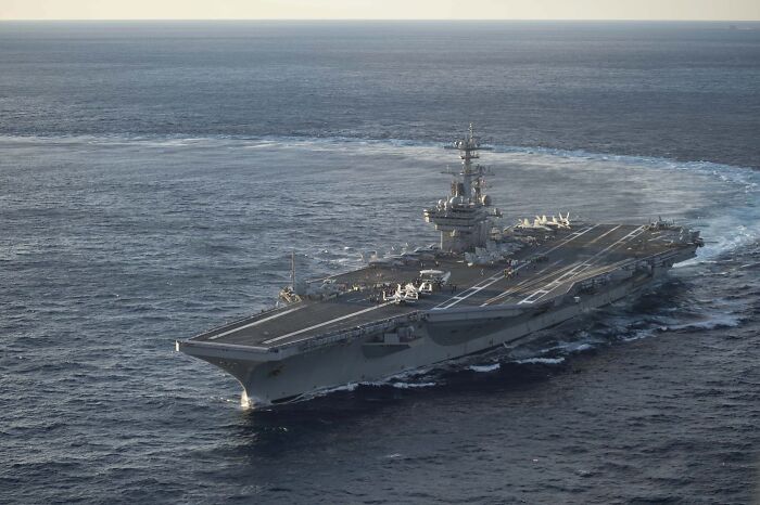 Aircraft carrier sailing in open ocean, relevant to Trump rant about magnets and steam aboard military ship. Aircraft carrier sailing in open ocean, relevant to Trump rant about magnets and steam aboard military ship.