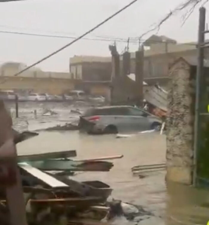 Flooded street with damaged cars and debris showcasing Hurricane Melissa devastation across Jamaica. Flooded street with damaged cars and debris showcasing Hurricane Melissa devastation across Jamaica.
