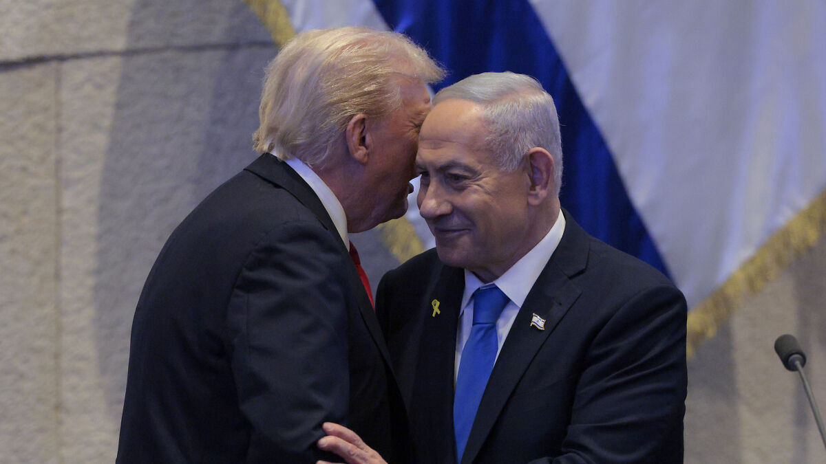 Donald Trump and Benjamin Netanyahu sharing a close moment at the Knesset with Israeli flags in the background.