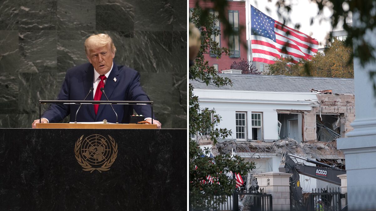White House official speaking at podium next to East Wing demolition site with American flag in the background.