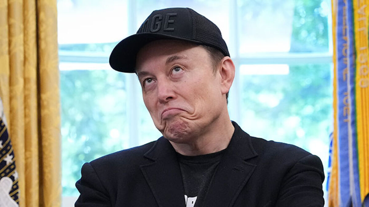 Elon Musk wearing a black cap and jacket indoors, symbolizing post-Boomer tycoons redefining dinner with lab meat and app groceries.