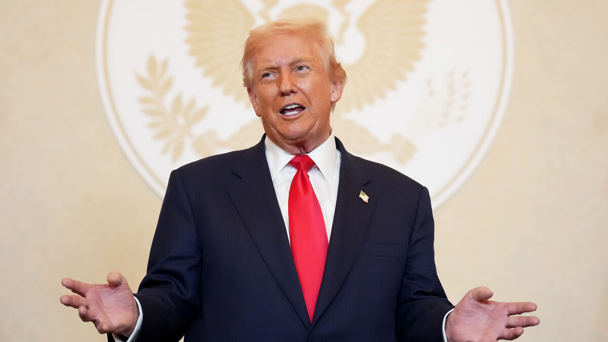 Donald Trump speaking with expressive hand gestures at Asia Summit, related to Modi and Indian accent controversy.