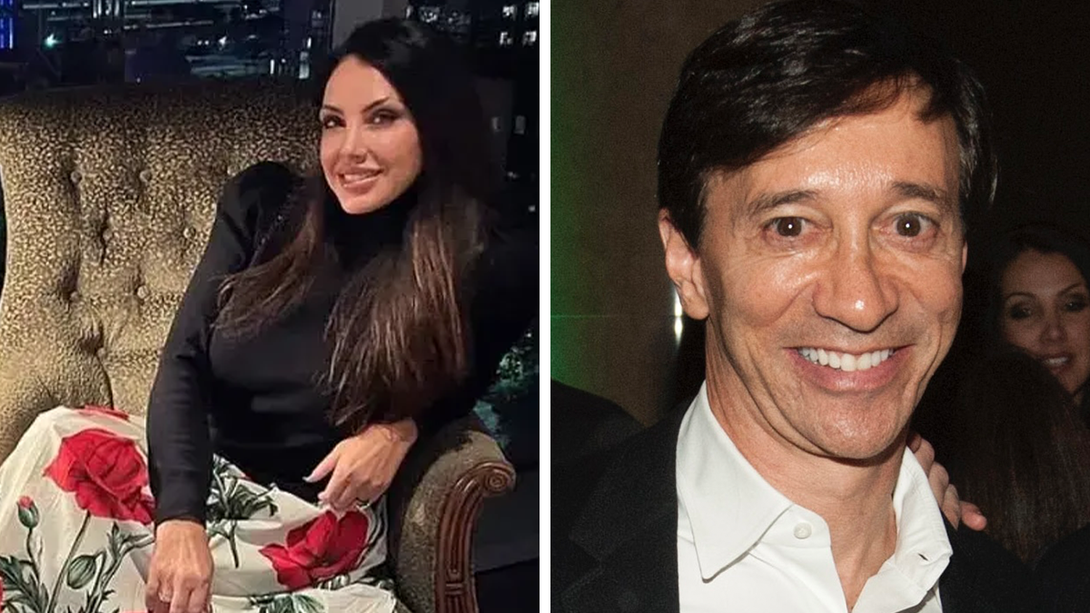Woman in floral skirt and black top sitting on chair beside smiling man in white shirt and dark jacket, related to trafficking allegations.
