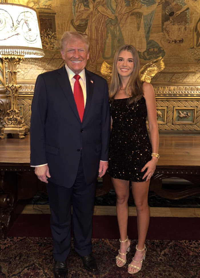 Donald Trump and his granddaughter posing indoors, highlighting Trump’s longstanding hand problems revealed unintentionally. Donald Trump and his granddaughter posing indoors, highlighting Trump’s longstanding hand problems revealed unintentionally.