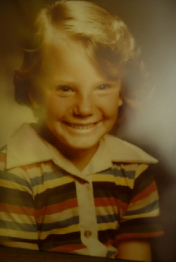 Smiling young girl in striped shirt, representing the Florida case of a man executed for child abduction and m****r.