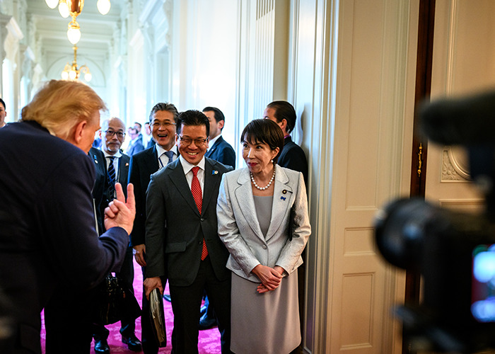 Group of world leaders in a hallway discussing new energy initiatives at a G20 summit event. Group of world leaders in a hallway discussing new energy initiatives at a G20 summit event.