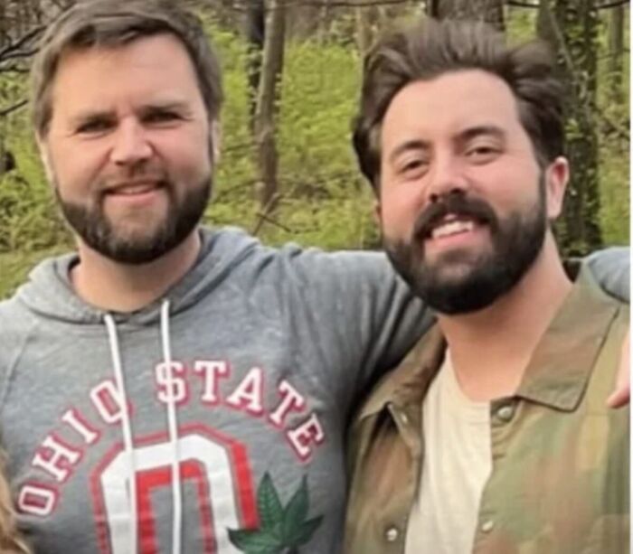 Two men smiling outdoors, one wearing an Ohio State hoodie, related to Vance clan and Cincinnati election.
