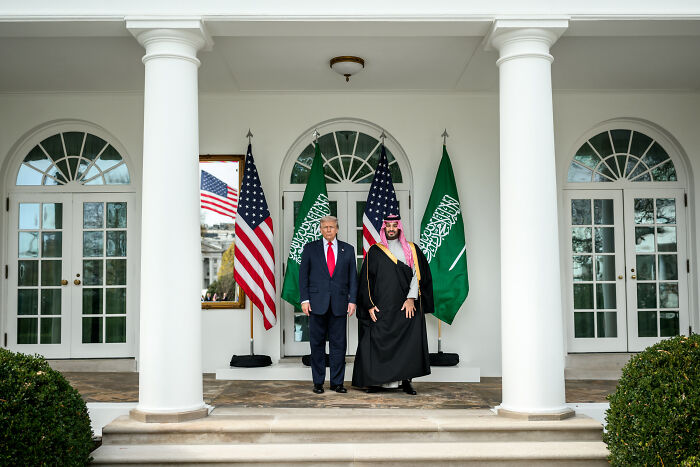 Donald Trump stands with Saudi prince under flags at White House, relating to Trump defending Saudi prince and Khashoggi controversy. Donald Trump stands with Saudi prince under flags at White House, relating to Trump defending Saudi prince and Khashoggi controversy.