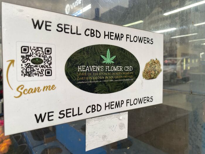 Sign advertising CBD hemp flowers from Heaven's Flower CBD, highlighting a family source of income and government impact. Sign advertising CBD hemp flowers from Heaven's Flower CBD, highlighting a family source of income and government impact.