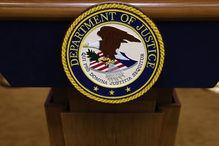 Seal of the Department of Justice on a podium, related to the teen at center of Matt Gaetz probe and shelter living. Seal of the Department of Justice on a podium, related to the teen at center of Matt Gaetz probe and shelter living.