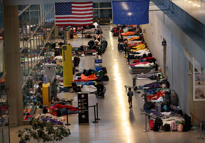 Migrants housed in airport terminal despite safety concerns amid Biden administration policies and ongoing immigration issues.