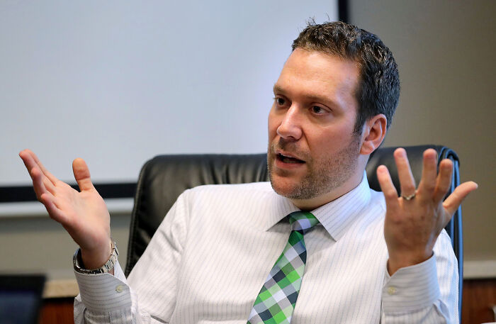 Man in a striped shirt and green plaid tie gesturing while discussing the teen at center of Matt Gaetz probe. Man in a striped shirt and green plaid tie gesturing while discussing the teen at center of Matt Gaetz probe.