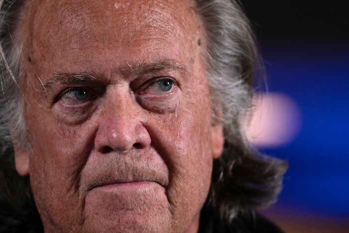 Steve Bannon close-up portrait with serious expression amid controversy over Republicans facing jail after midterms.