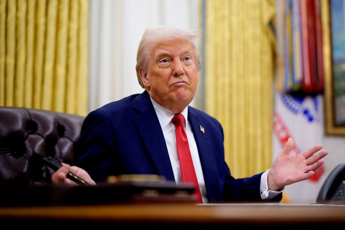 Donald Trump in a suit and red tie at a desk, urging GOP support for the release of Epstein files. Donald Trump in a suit and red tie at a desk, urging GOP support for the release of Epstein files.
