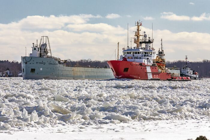 Coast Guard ships navigating through icy waters, highlighting Trump claims about redesigning ships for aesthetics. Coast Guard ships navigating through icy waters, highlighting Trump claims about redesigning ships for aesthetics.