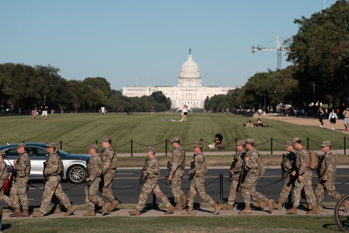 National Guard troops marching near the Capitol in Washington as ordered to remain until end of February by Donald Trump. National Guard troops marching near the Capitol in Washington as ordered to remain until end of February by Donald Trump.